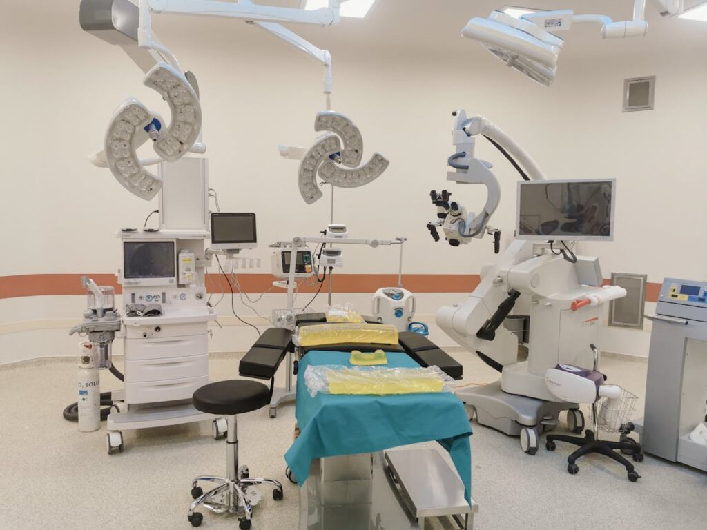 A state-of-the-art operating room fully equipped with advanced medical devices and surgical tools.